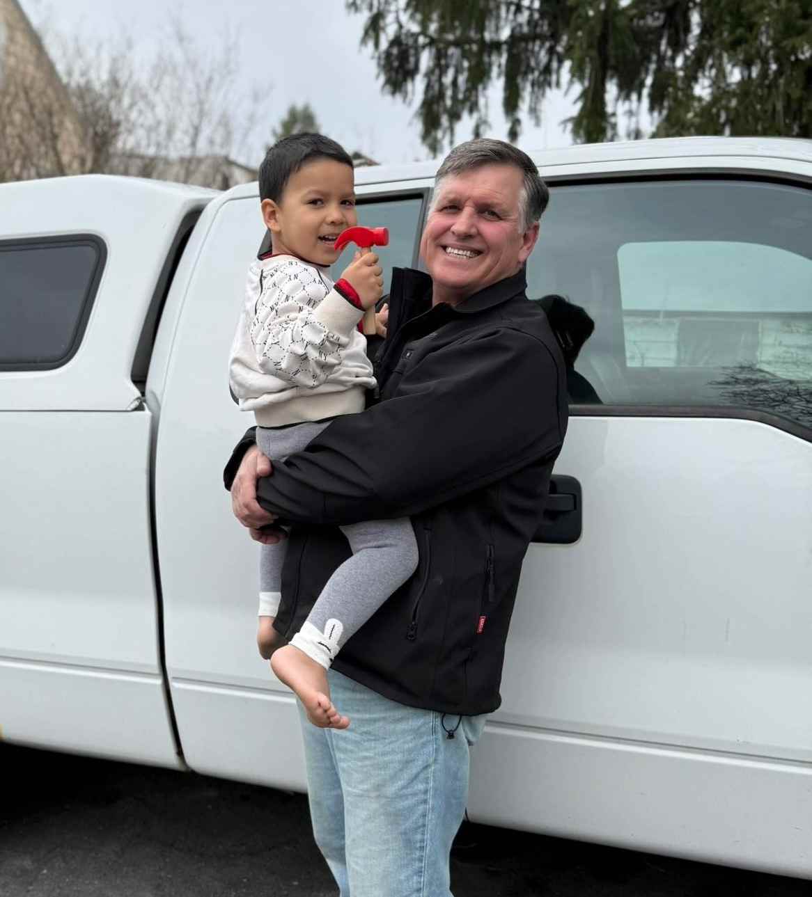 Pete Baron standing next to work truck
